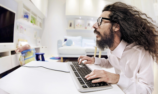 A programmer fully immersed in his work in the office